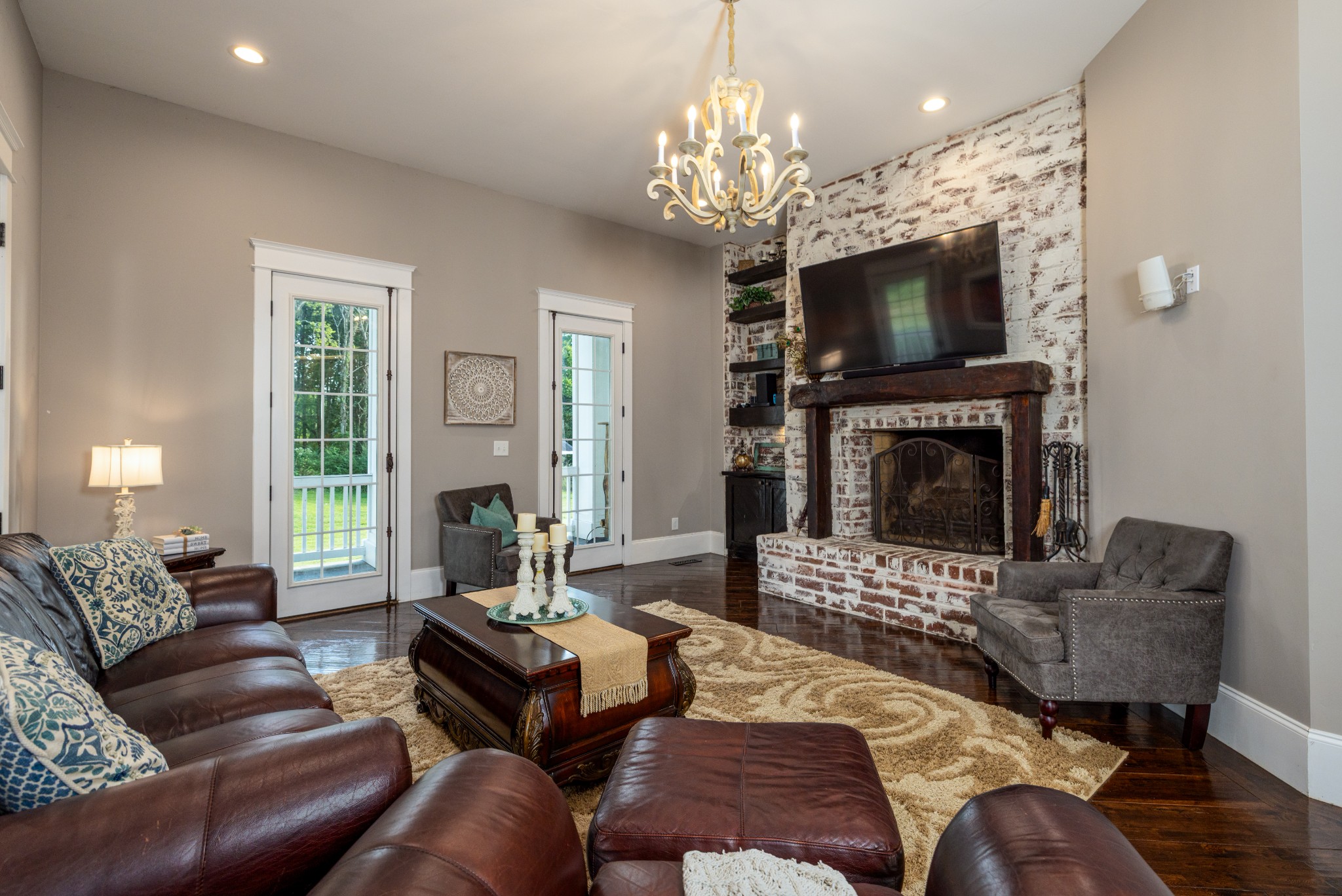 1181 Chicken Road Lebanon, TN 37090 - Photo 15 of 63 a living room with furniture a flat screen tv and a fireplace