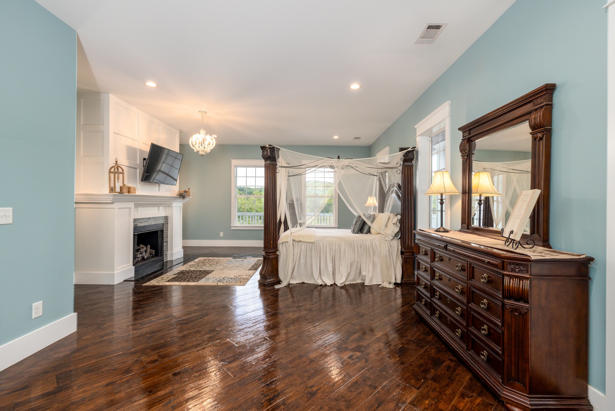 1181 Chicken Road Lebanon, TN 37090 - Photo 25 of 63 a spacious bedroom with a bed and a fireplace