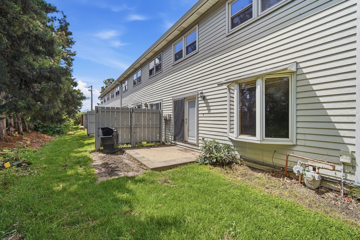 1532 Hunt Drive, Unit A Normal, IL 61761 - Photo 24 of 25 a view of a house with backyard and sitting area