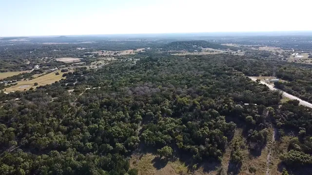 an aerial view of residential house and green space