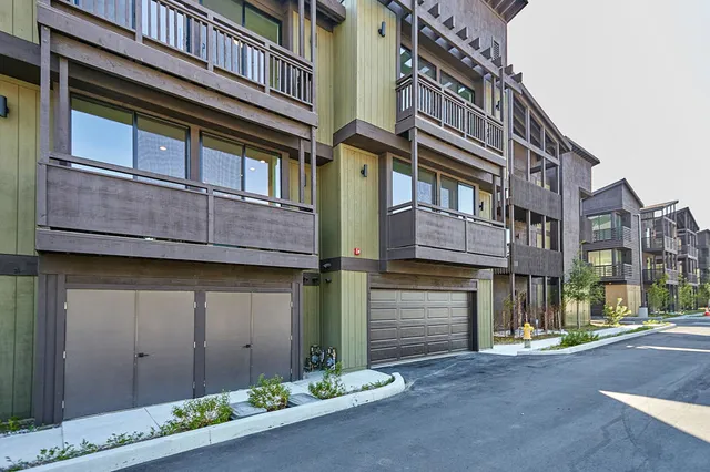 a view of a brick building with many windows