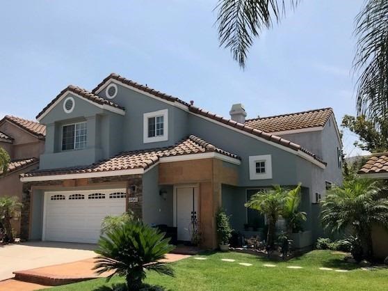 15731 Firethorn Road Fontana, CA 92337 - Photo 1 of 1 a front view of a house with garden