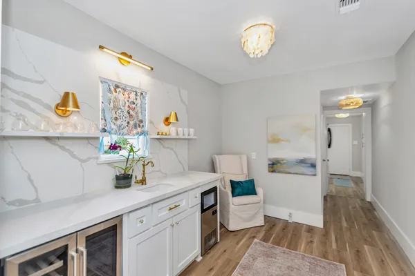 a kitchen with a sink and a refrigerator