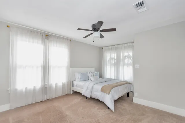 a bathroom with a shower toilet and sink