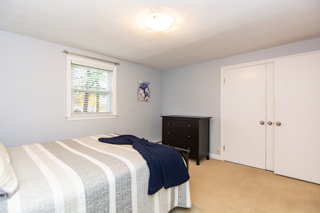 7 Sheffield Road Natick, MA 01760 - Photo 13 of 27 a bedroom with a bed and a window