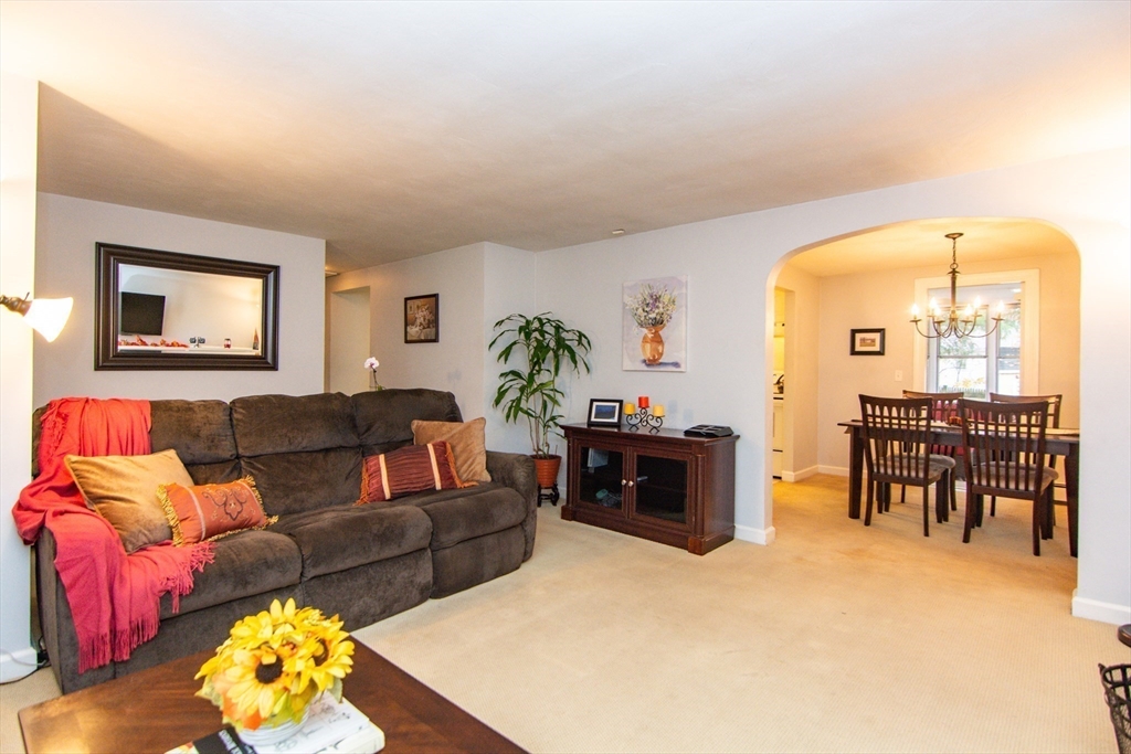 7 Sheffield Road Natick, MA 01760 - Photo 15 of 27 a living room with furniture and a large window