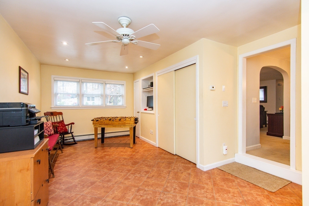 7 Sheffield Road Natick, MA 01760 - Photo 17 of 27 a bedroom with a bed and a chandelier