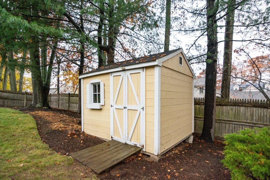 7 Sheffield Road Natick, MA 01760 - Photo 22 of 27 a view of a house with a yard