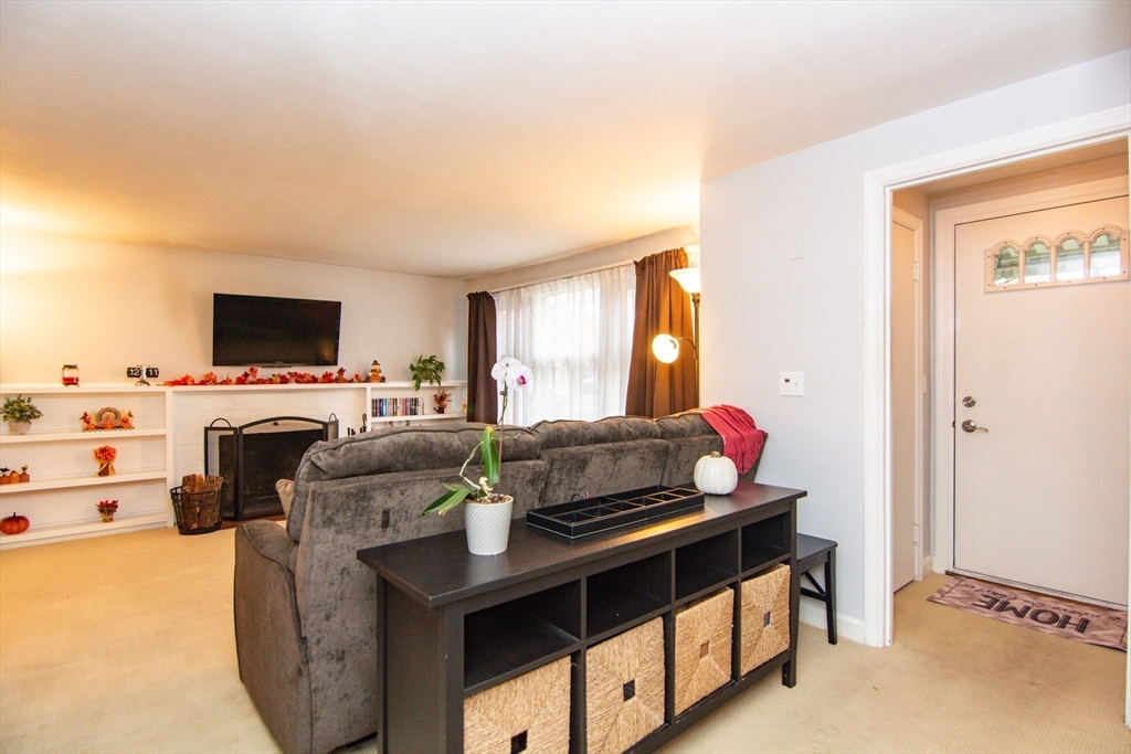 7 Sheffield Road Natick, MA 01760 - Photo 3 of 27 a living room with furniture and a flat screen tv