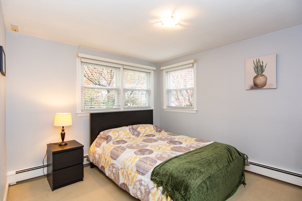 7 Sheffield Road Natick, MA 01760 - Photo 9 of 27 a bedroom with a bed and window