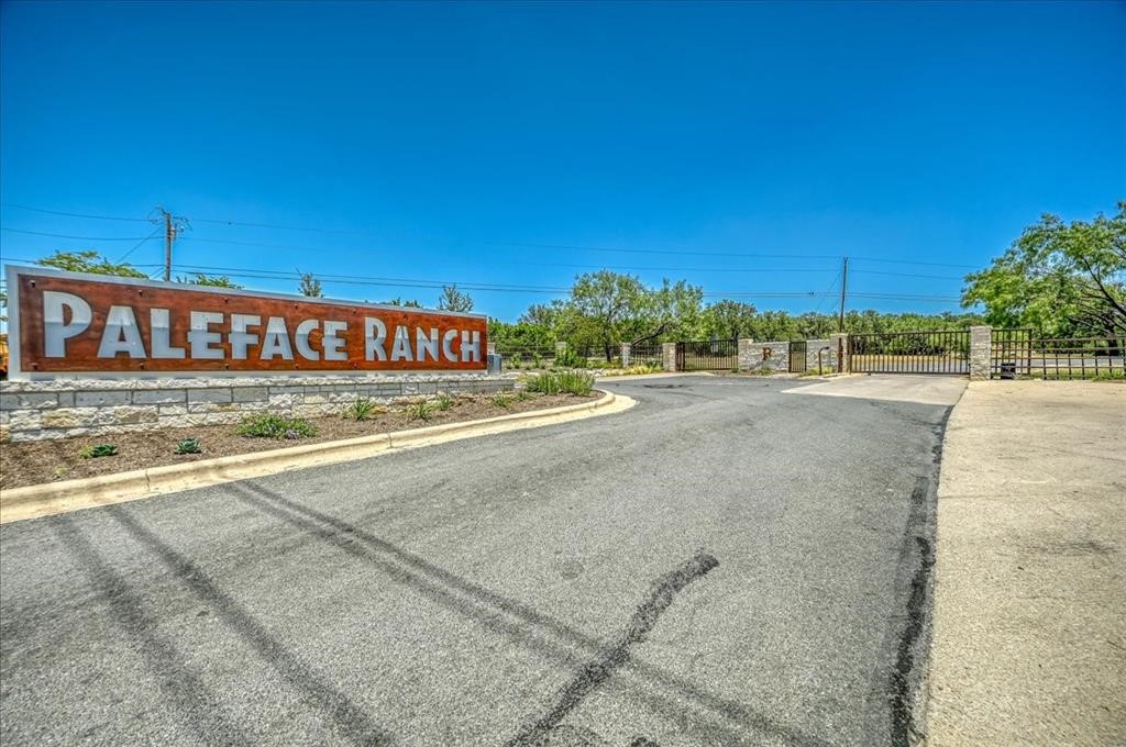 1909 Performer Road Spicewood, TX 78669 - Photo 6 of 19 a view of a street with a building in the background