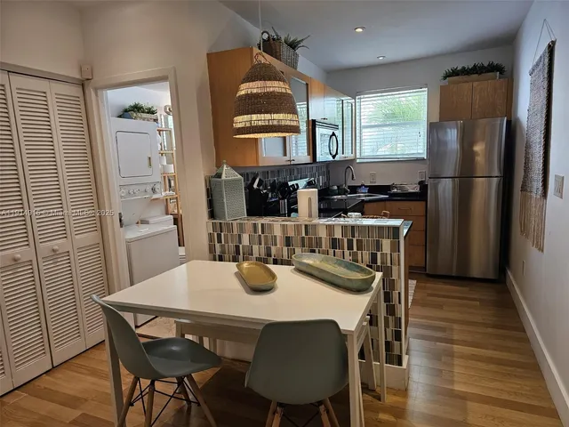 a view of a dining room with furniture and window