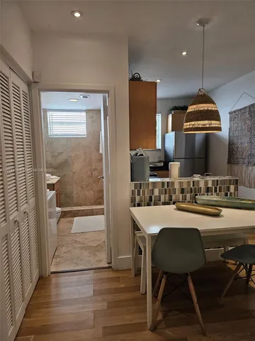 a kitchen with a table and chairs