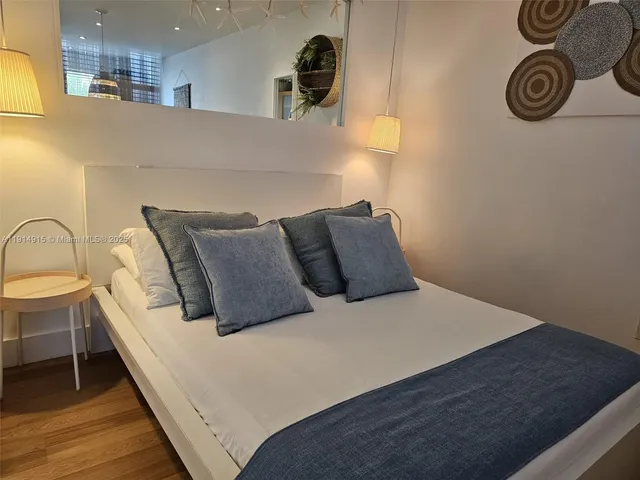 a bedroom with a bed and dresser