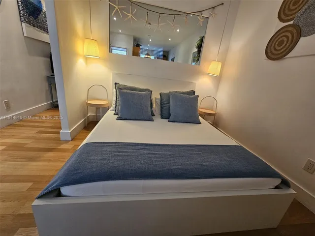 a view of kitchen and hall with wooden floor