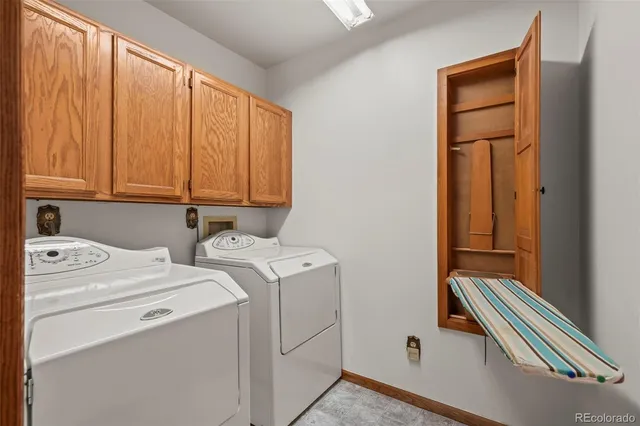 a view of storage and utility room with washer and dryer