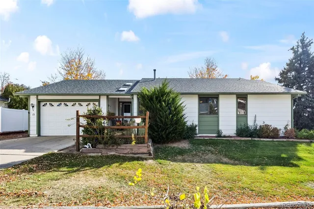 a view of a house with swimming pool and sitting area