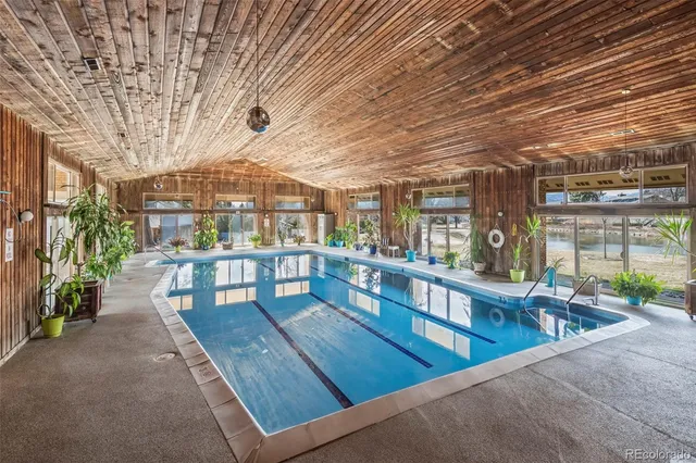 a view of a patio with swimming pool