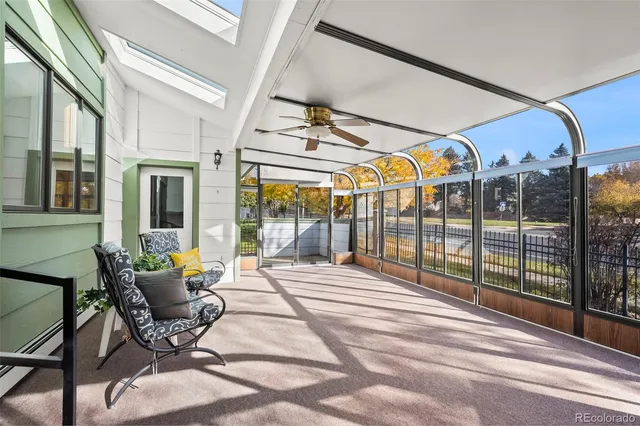 a view of a patio with a table and chairs