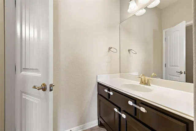 an empty room with wooden floor and closet