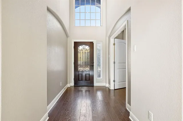 a view of an entryway with wooden floor