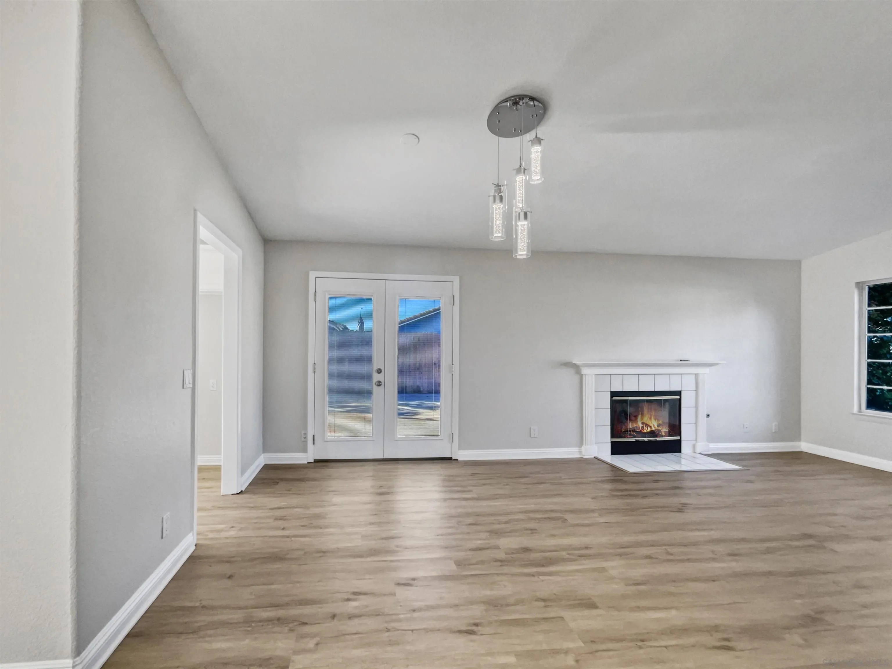 140 South Mercedes Road Fallbrook, CA 92028 - Photo 7 of 21 a view of empty room with wooden floor and fireplace