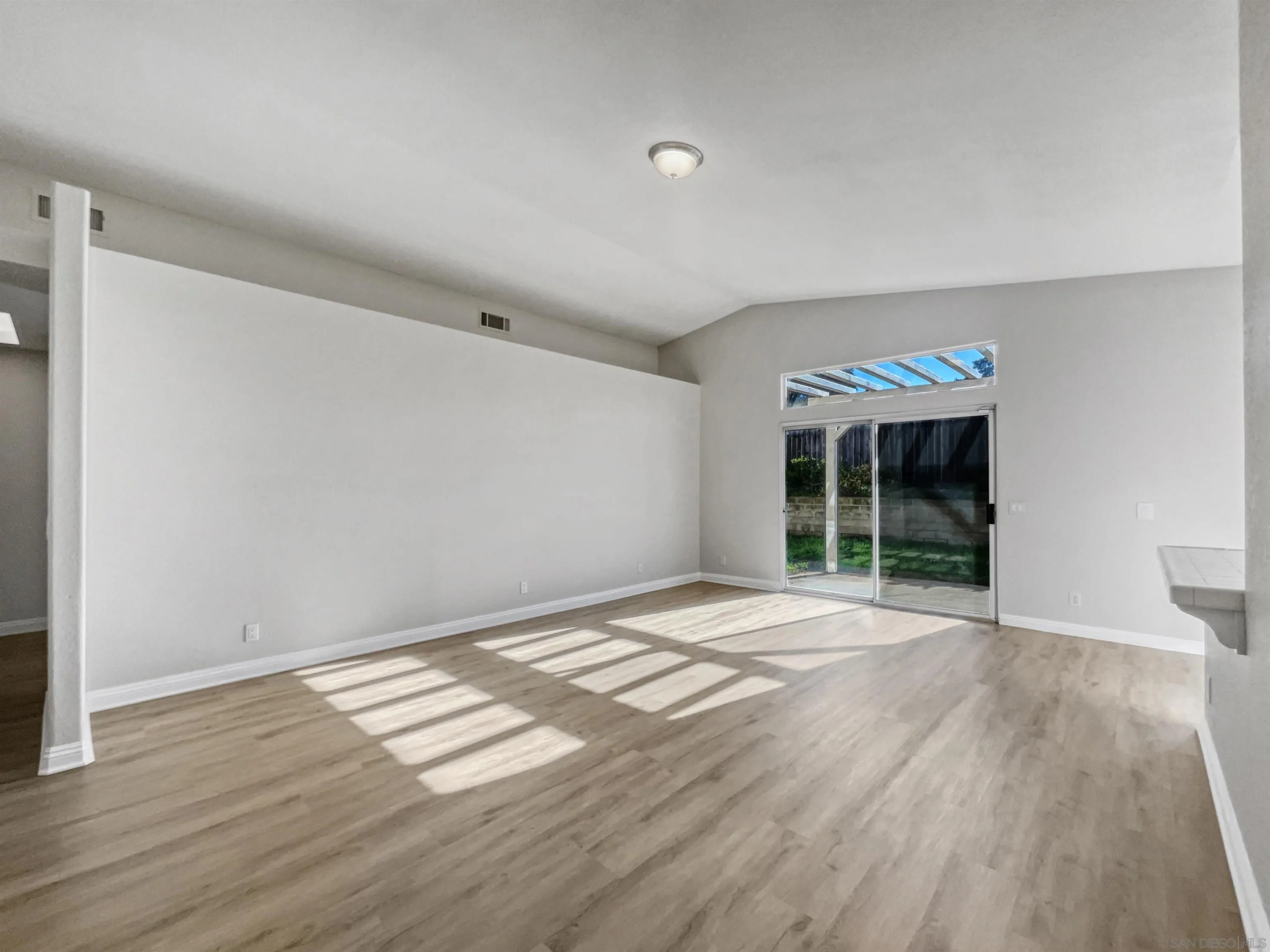 140 South Mercedes Road Fallbrook, CA 92028 - Photo 8 of 21 a view of an empty room with wooden floor and a window