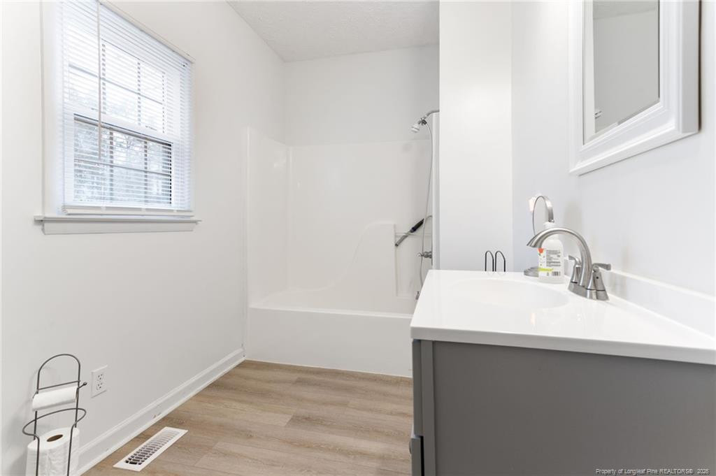 1069 Union Valley Road Whiteville, NC 28472 - Photo 24 of 50 a bathroom with a sink and a bathtub
