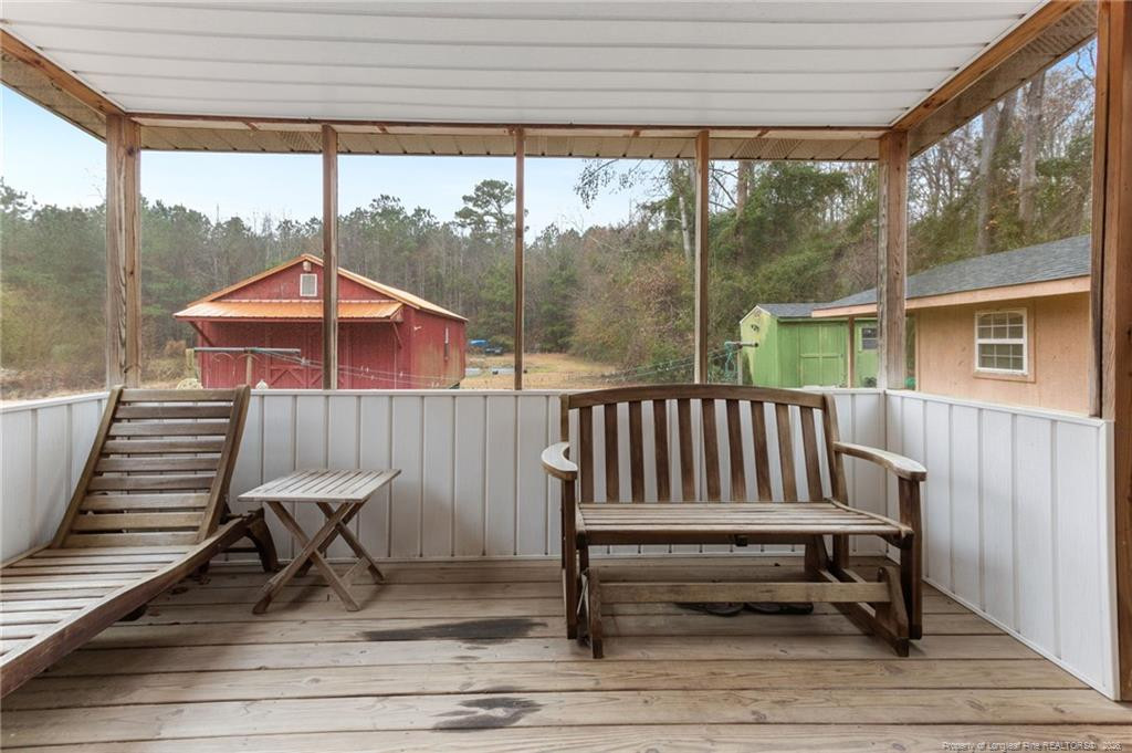 1069 Union Valley Road Whiteville, NC 28472 - Photo 26 of 50 a view of a two chairs in the balcony