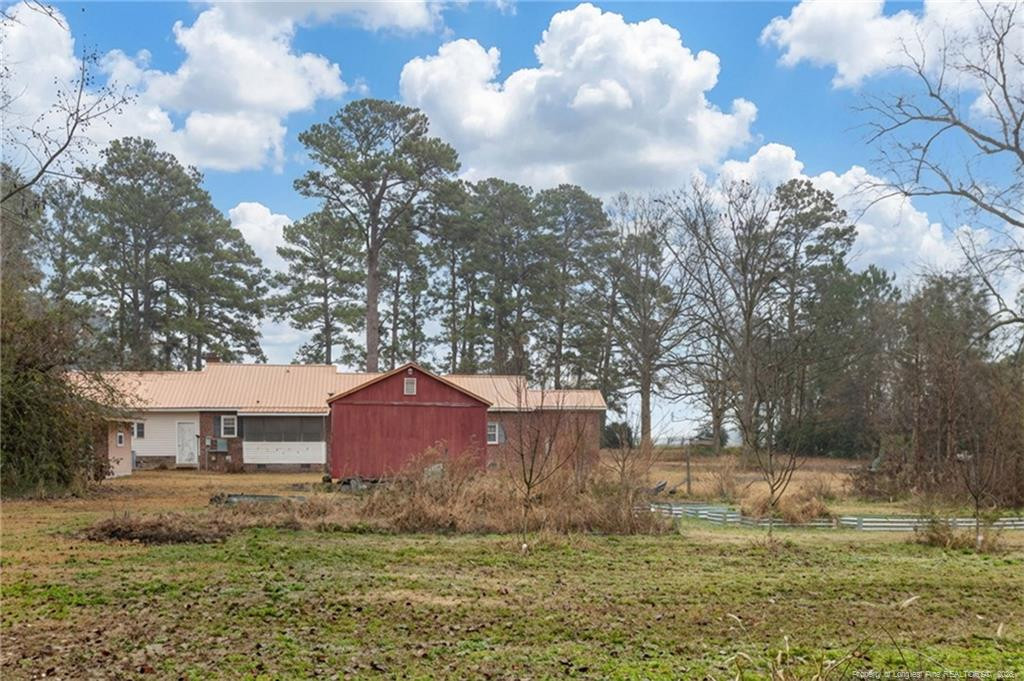 1069 Union Valley Road Whiteville, NC 28472 - Photo 28 of 50 a view of a yard with an outdoor space