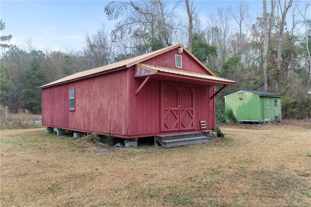 1069 Union Valley Road Whiteville, NC 28472 - Photo 29 of 50 a view of barn with a small yard