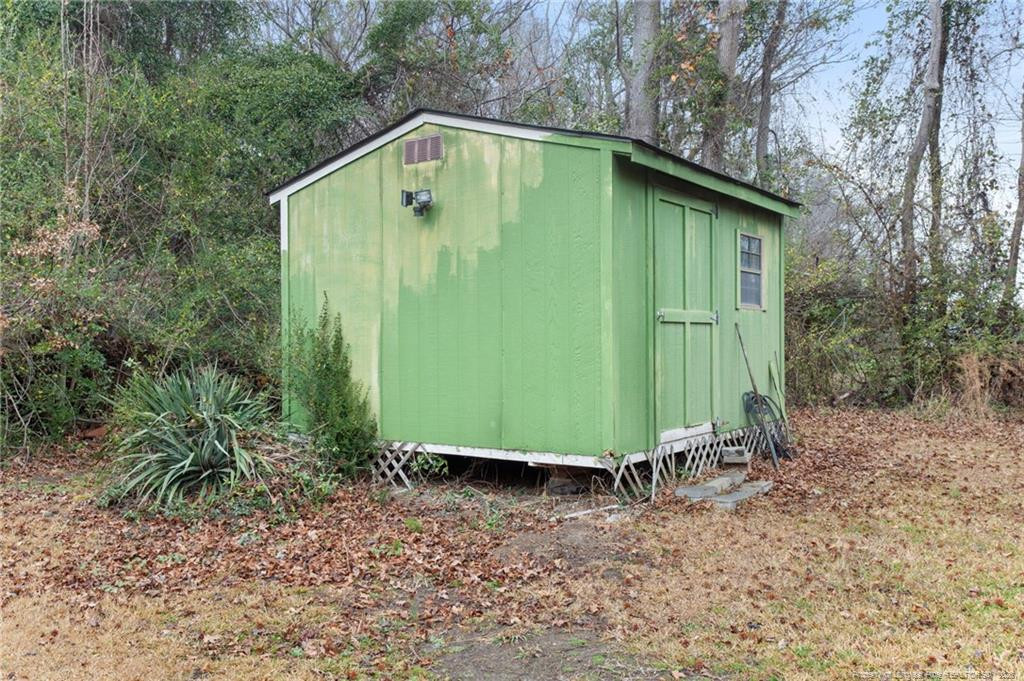 1069 Union Valley Road Whiteville, NC 28472 - Photo 30 of 50 a view of a backyard with potted plants