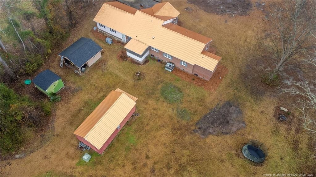 1069 Union Valley Road Whiteville, NC 28472 - Photo 33 of 50 an aerial view of a house with a yard and parking space