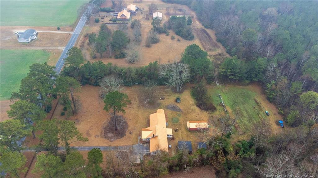1069 Union Valley Road Whiteville, NC 28472 - Photo 35 of 50 an aerial view of a house with a yard and a large tree