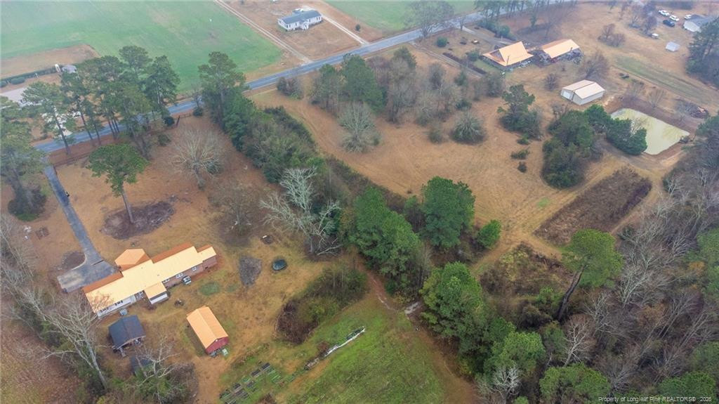 1069 Union Valley Road Whiteville, NC 28472 - Photo 36 of 50 an aerial view of a house with a yard