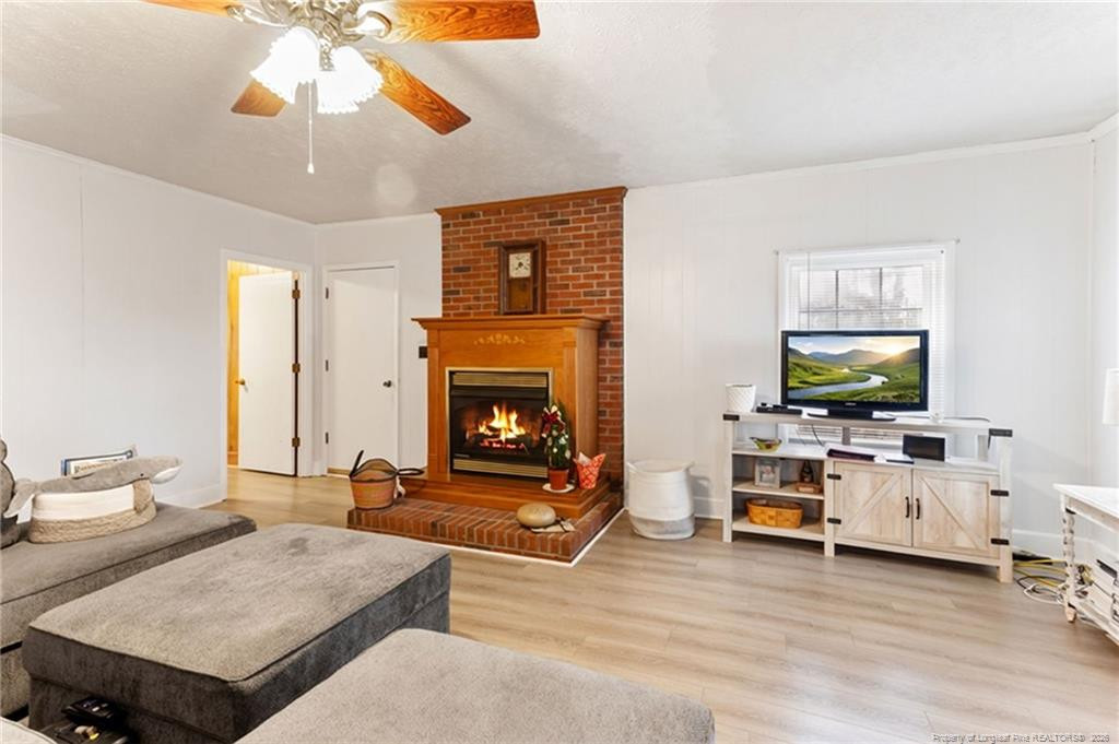 1069 Union Valley Road Whiteville, NC 28472 - Photo 6 of 50 a living room with furniture and a flat screen tv