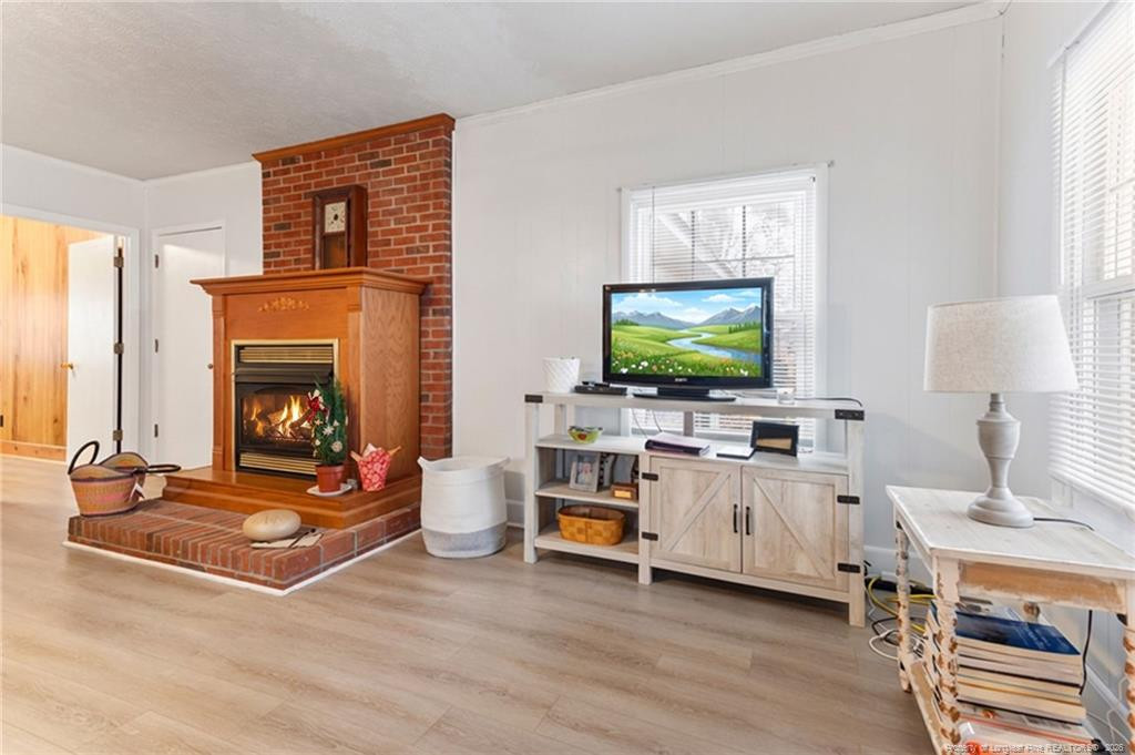 1069 Union Valley Road Whiteville, NC 28472 - Photo 7 of 50 a living room with furniture and a flat screen tv