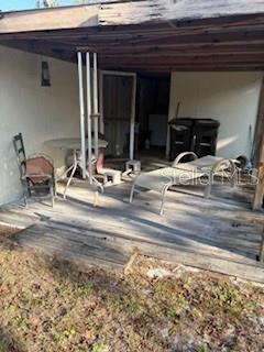 4405 Airport Road Plant City, FL 33563 - Photo 4 of 20 a view of pool table and chairs in front of house