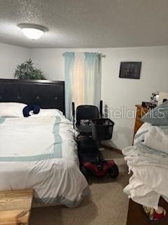 4405 Airport Road Plant City, FL 33563 - Photo 9 of 20 a bedroom with a bed and a couch