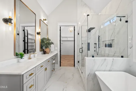 a spacious bathroom with a granite countertop sink and a mirror