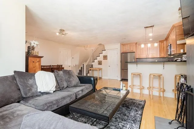 a living room with furniture and a rug