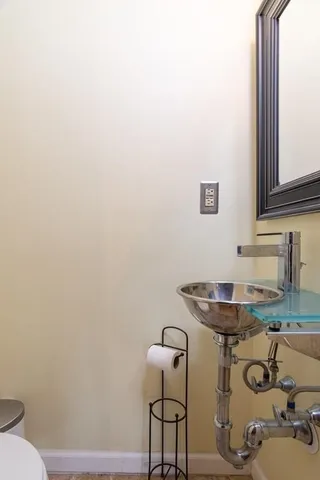 a bathroom with a sink and mirror