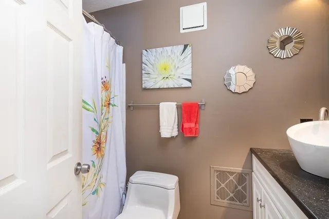 a bathroom with a toilet and a sink