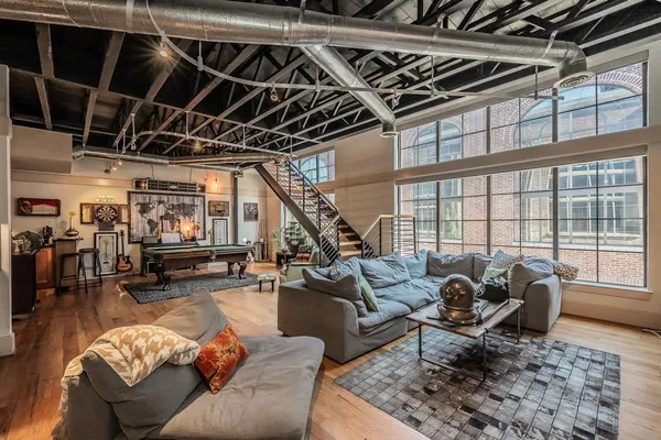a living room with furniture or couch and a table