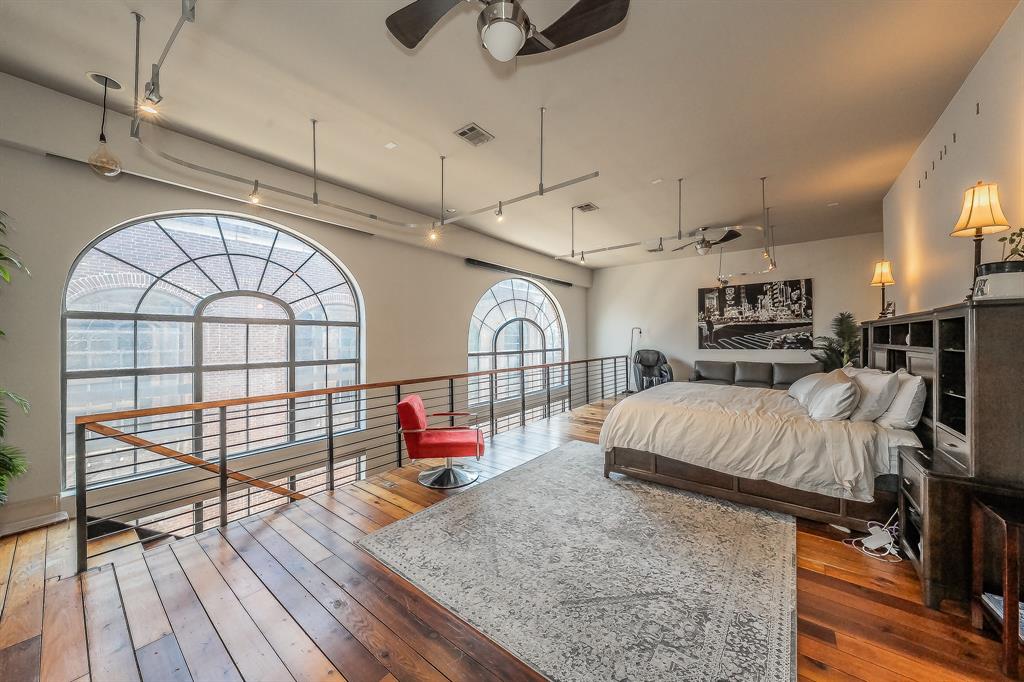 3911 Gilbert Avenue, Unit G Dallas, TX 75219 - Photo 22 of 35 a view of livingroom with furniture wooden floor and window