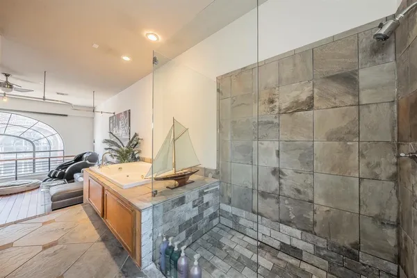 a spacious bathroom with a double vanity sink a and a mirror