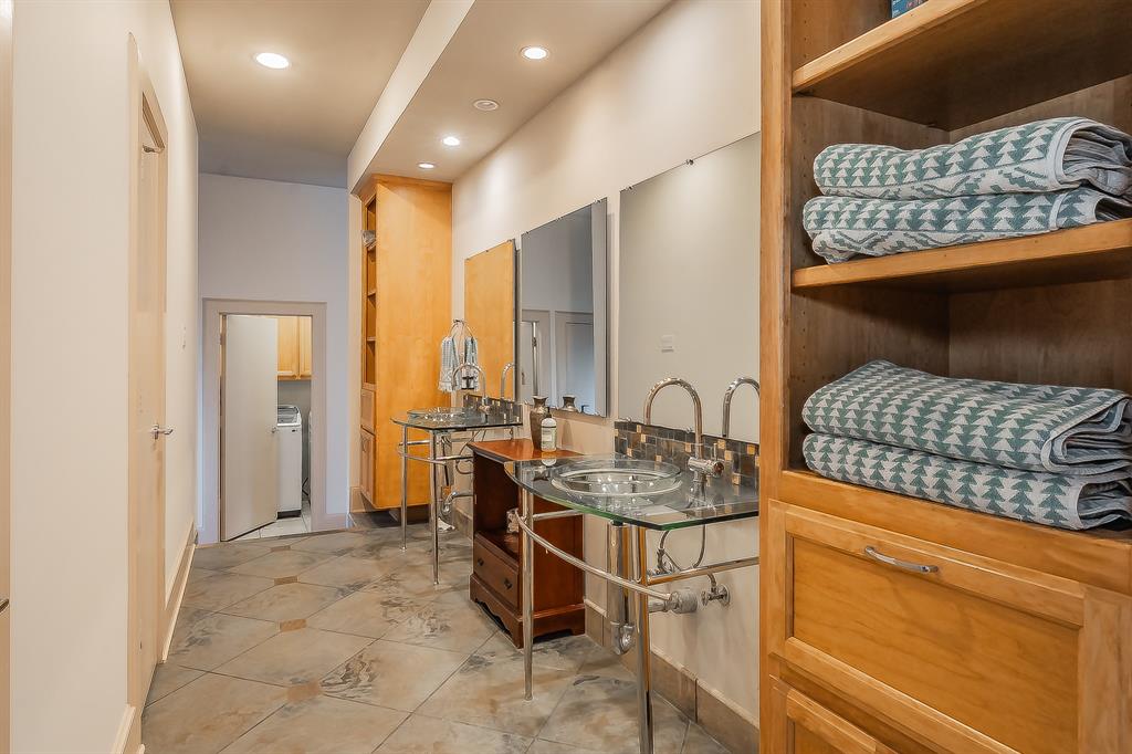 3911 Gilbert Avenue, Unit G Dallas, TX 75219 - Photo 27 of 35 a open kitchen with stainless steel appliances granite countertop a sink and cabinets