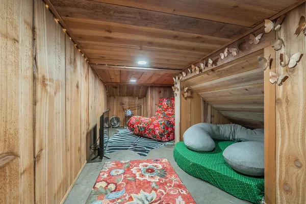 a room with green walls stairs and a potted plant