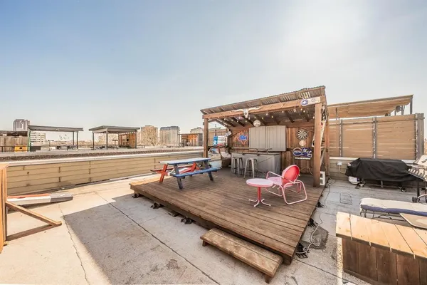 a outdoor living space with furniture and a floor to ceiling window