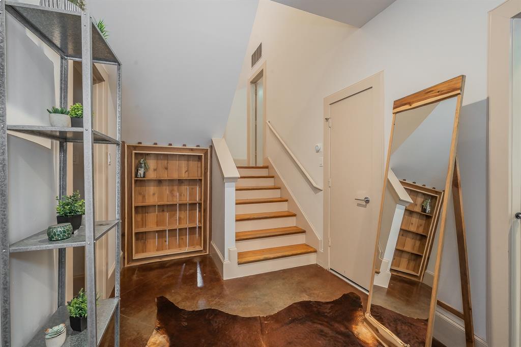 3911 Gilbert Avenue, Unit G Dallas, TX 75219 - Photo 4 of 35 a view of a livingroom with furniture and staircase